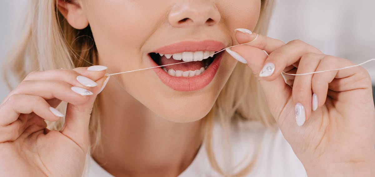 Regular flossing for good dental health Regular flossing for good dental health