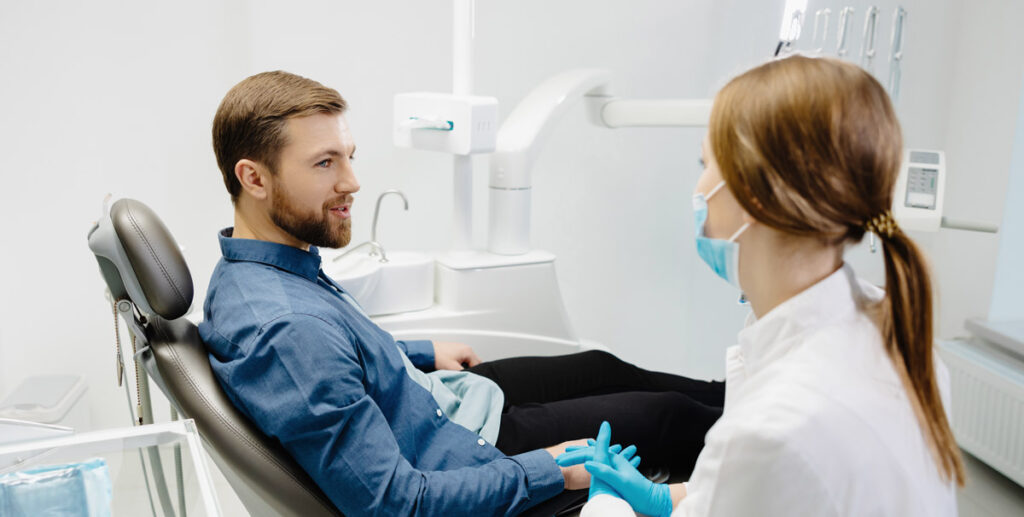 man in dental chair consultation