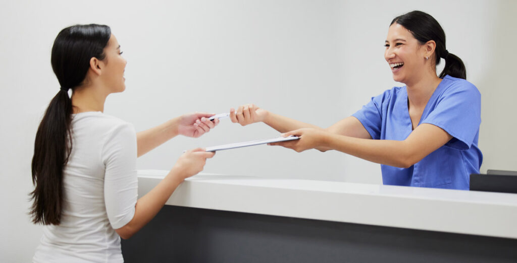 woman in reception at dental clinic